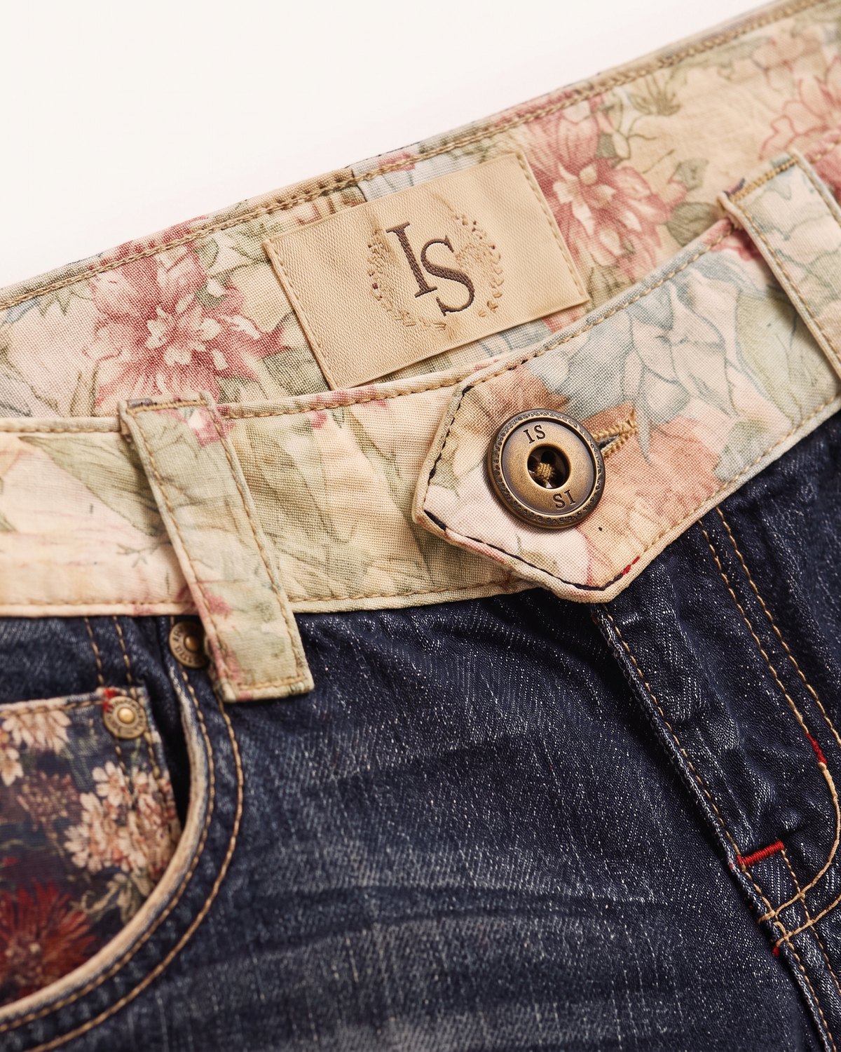 Macro Close-Up of the vintage floral waistband and brass button on Sunday Shore Low-Rise Shorts