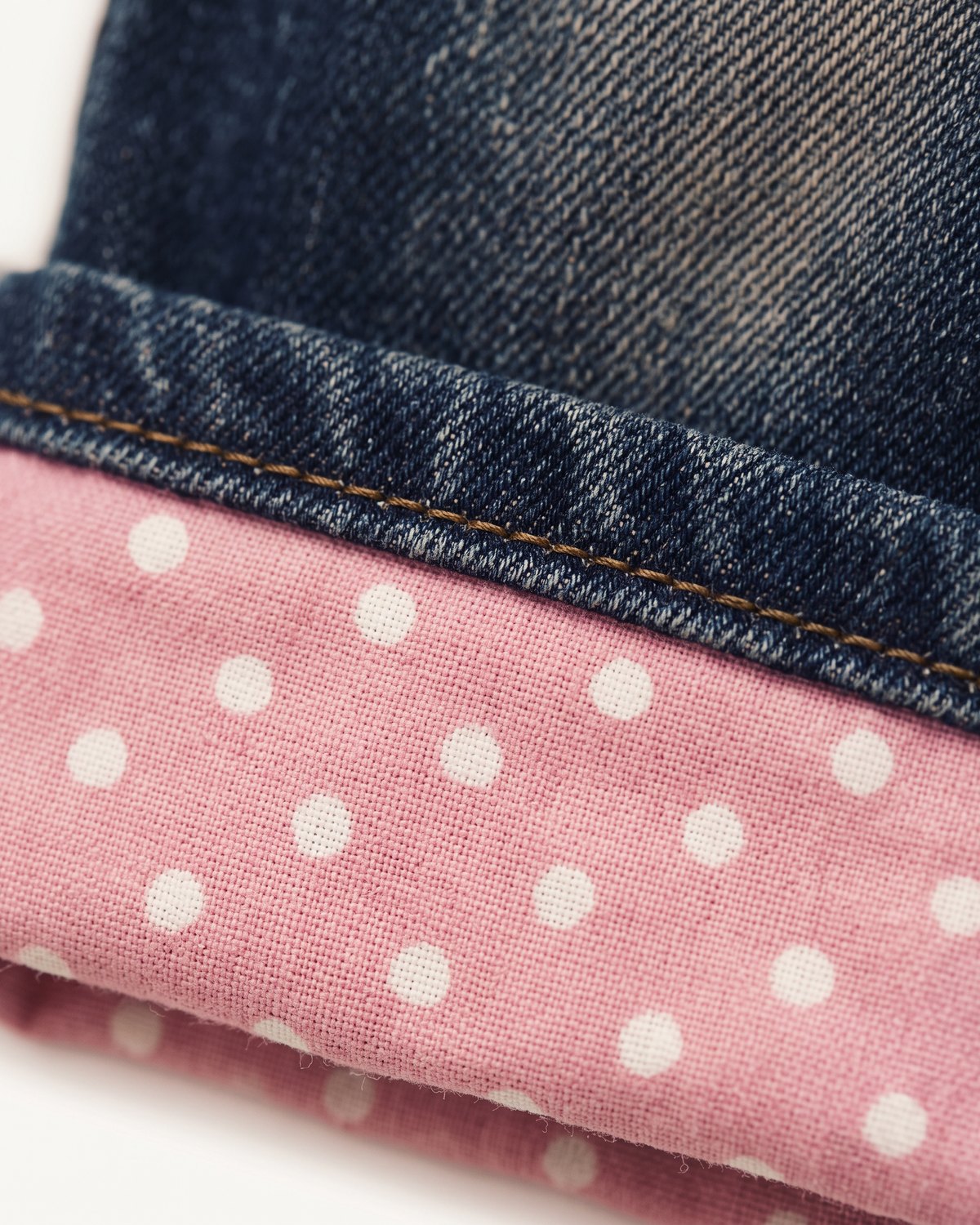 Macro Close-Up of the pink polka-dot turn-up cuff on Daydream Baggy Jeans