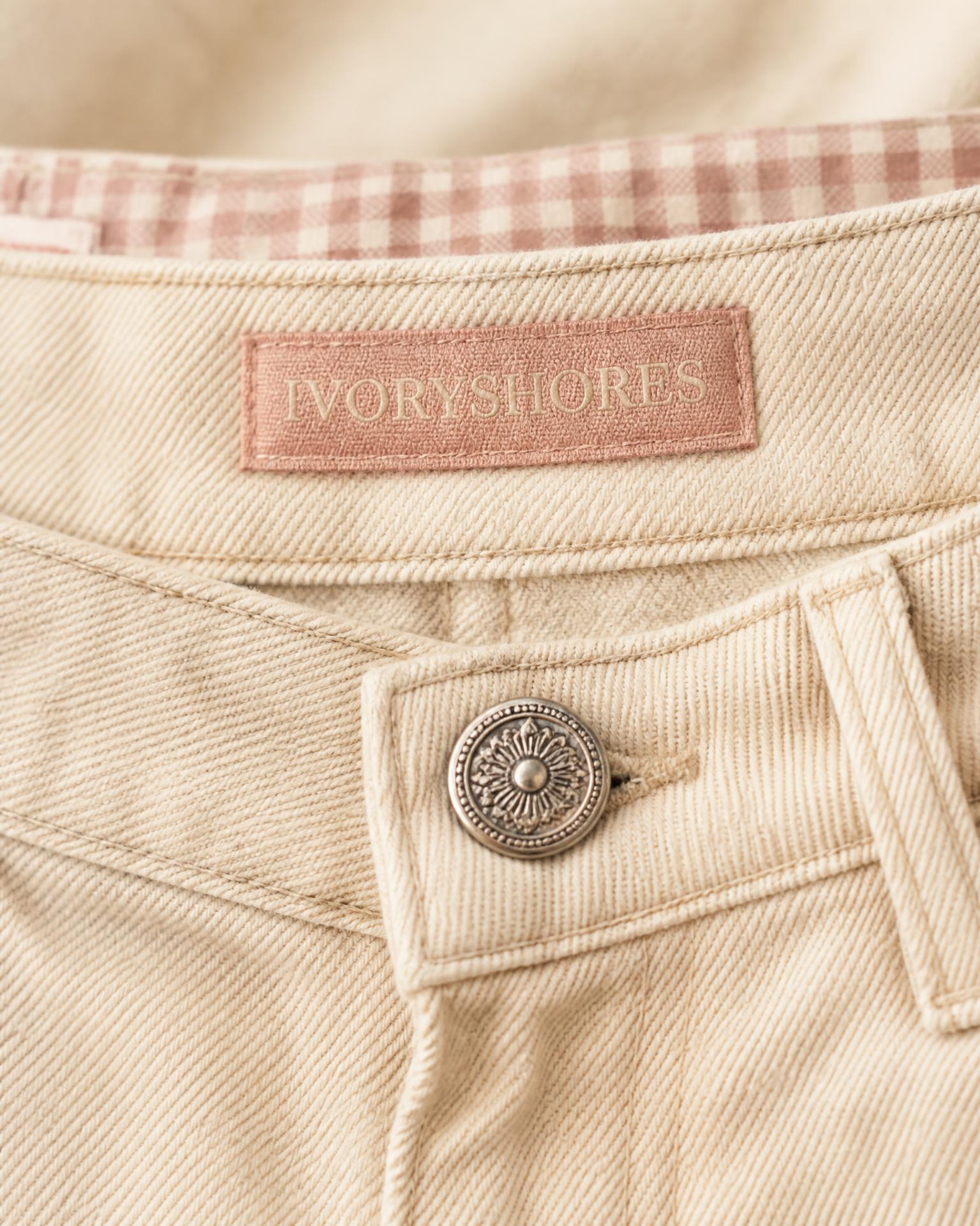 Close-Up of the dusty pink Ivoryshores waistband label and gingham lining on Petal Cove Low-Rise Shorts